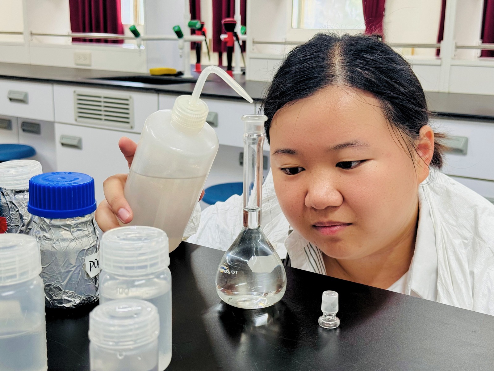 Student conducting experiments with high-nutrient salinity.