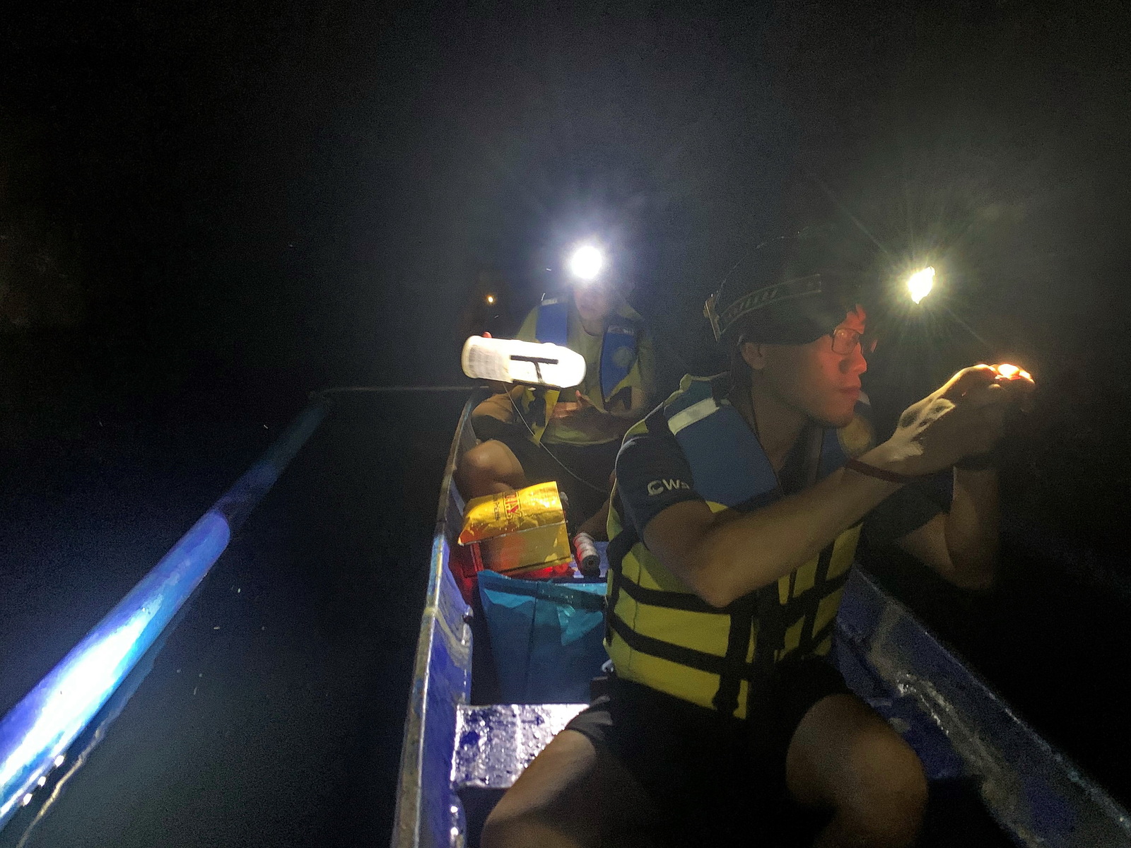 The team took a human-powered boat to set the bait traps in underground river caves.