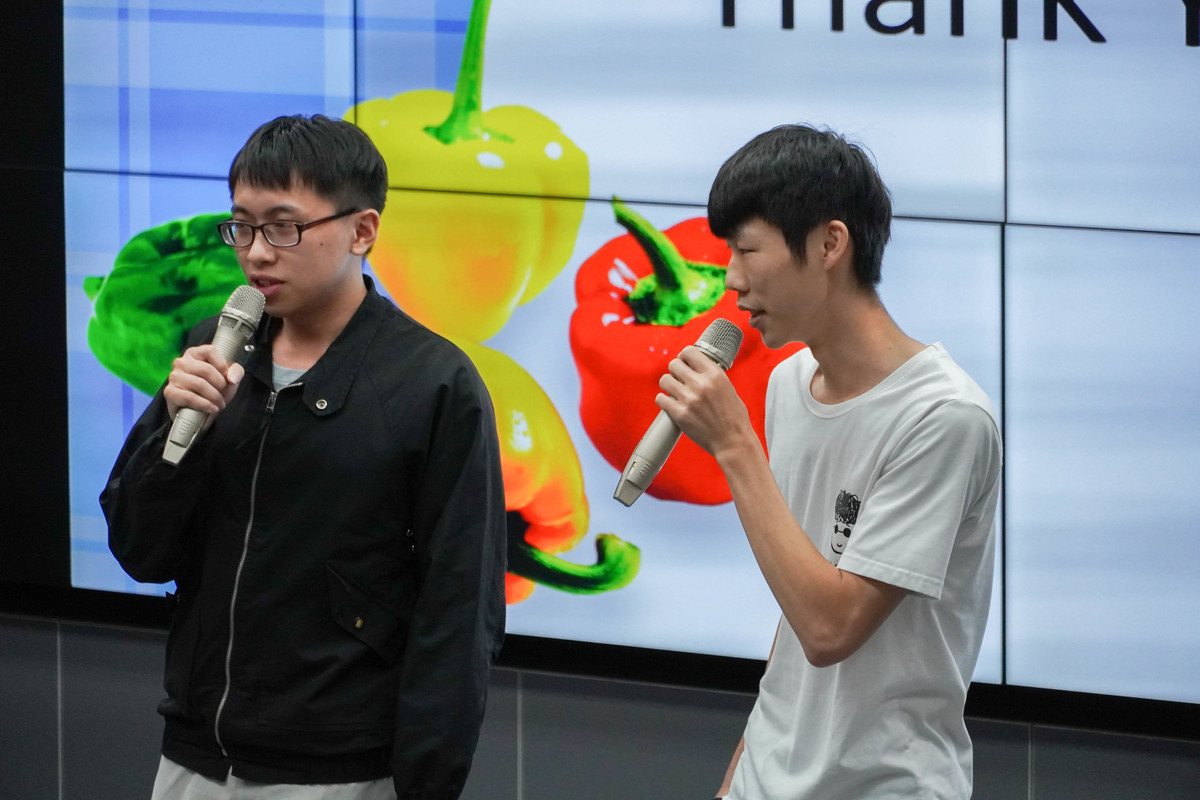 Student presenters Yen-Hsiang Huang and Kuang-Hung Chen, Department of Information Management, on their app design.