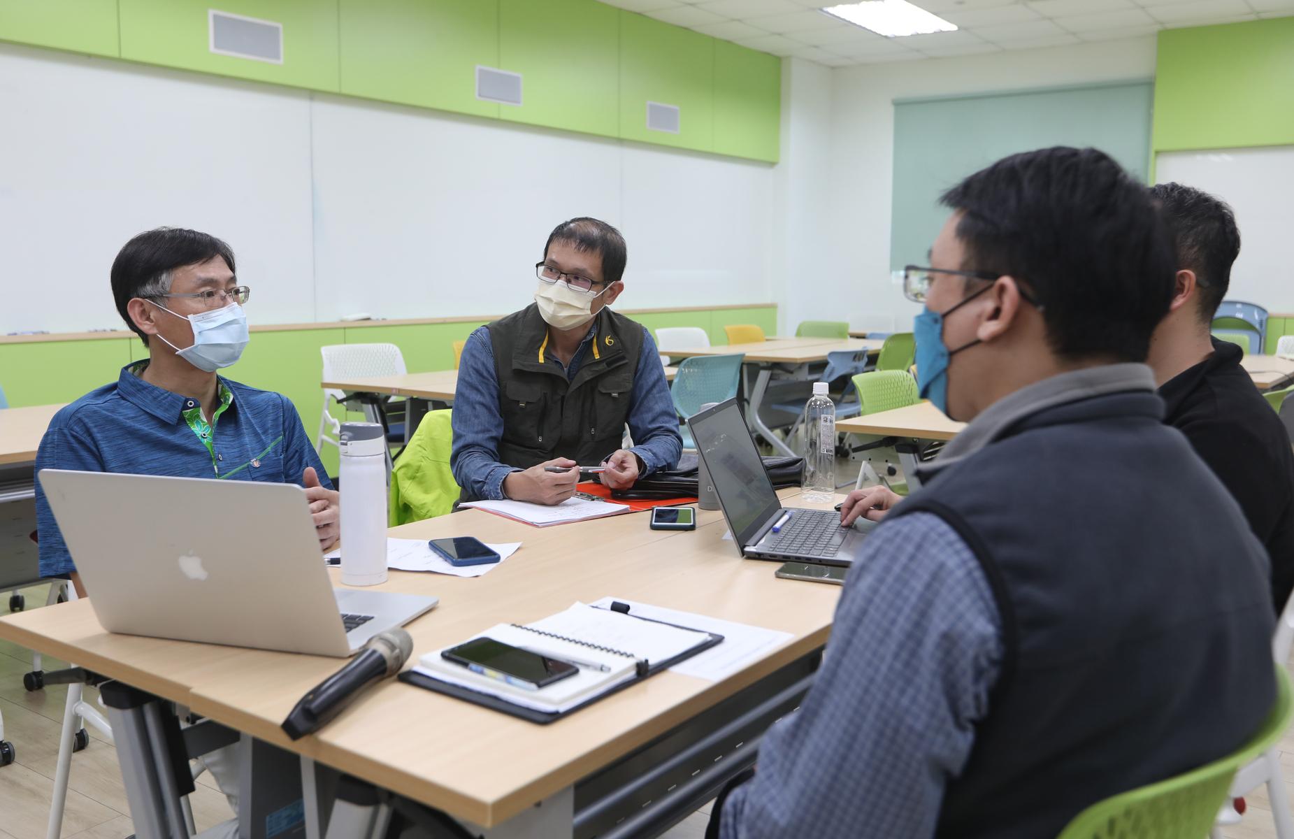 Teachers discuss project writing skills for teaching practice research in workshopImage