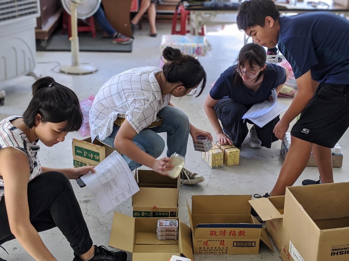 The students assisted in arranging and distributing donated goods.