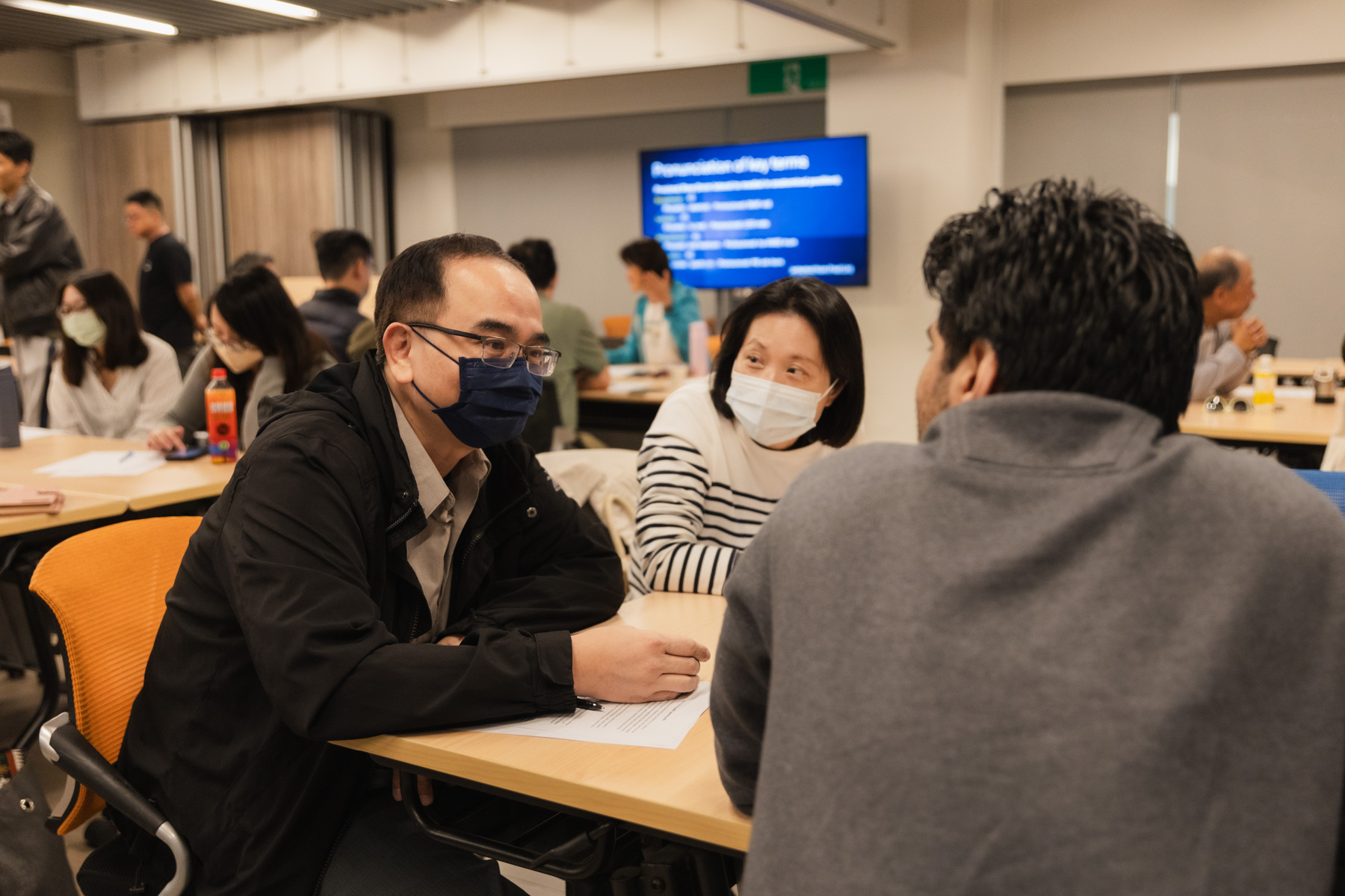 Participants interact during the EMI Professional Development workshops.Image