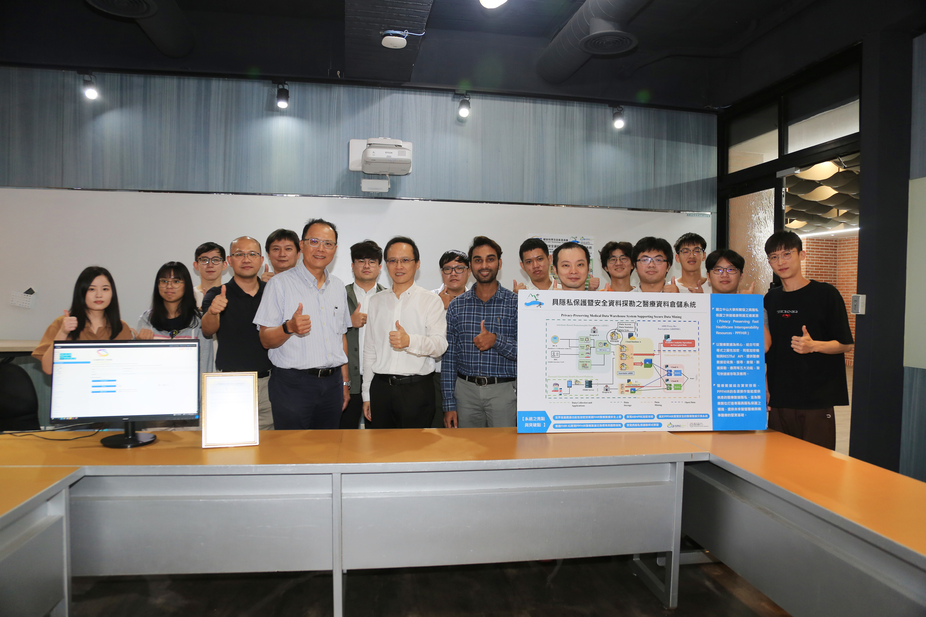 A group photo of the NSTC's Technology Promotion Program in Advanced Cybersecurity Research project "Privacy-Preserving Medical Data Warehouse System Supporting Secure Data Mining" members led by the Principal Investigator Chun-I Fan, Distinguished Professor of the Department of Computer Science and Engineering of NSYSU and Director of the Information Security Research Center at NSYSU.