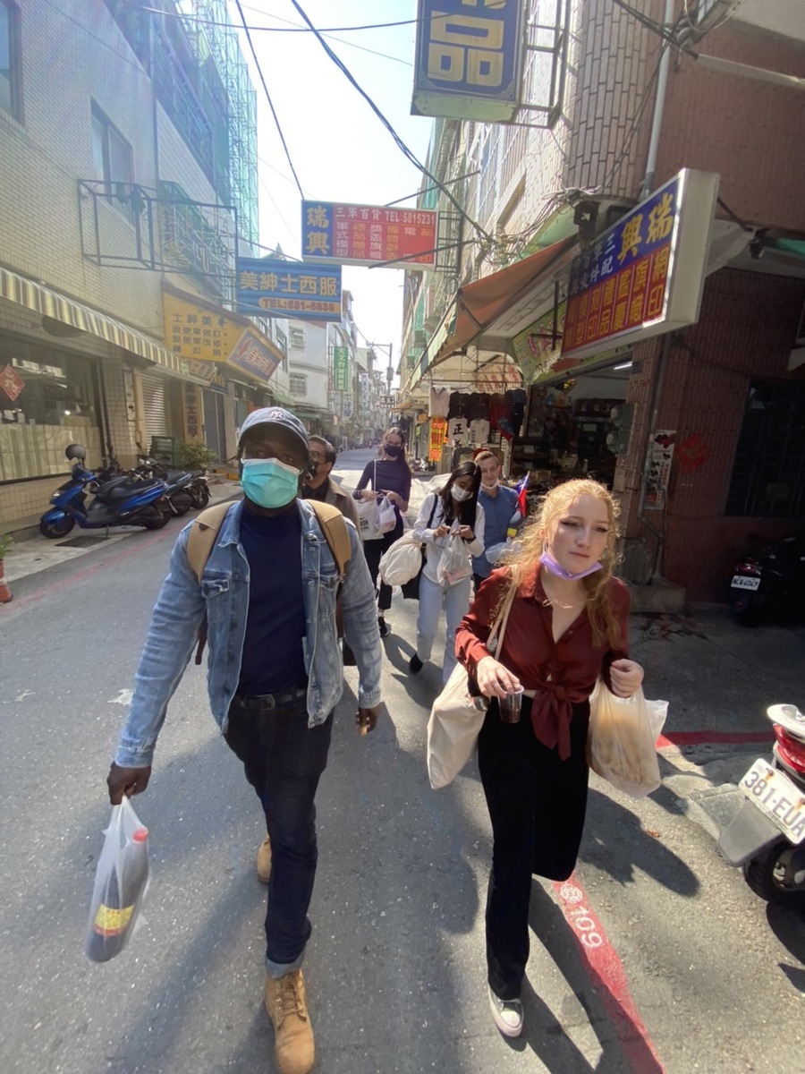 Assistant Professor Thiombiano Dramane Germain (first from the left) took international students on a walking tour around Zuoying.Image