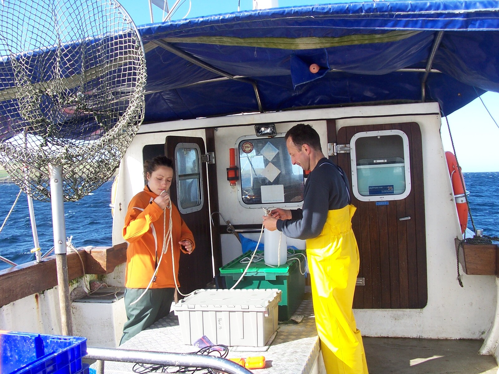 Sailing out of Scrabster Harbour, North Scotland, to collect water samples. On the right is Associate Professor François Muller, on the left is his colleague Dr Sílvia Batchelli of the University of the Highlands and Islands. (Photo provided by François Muller)