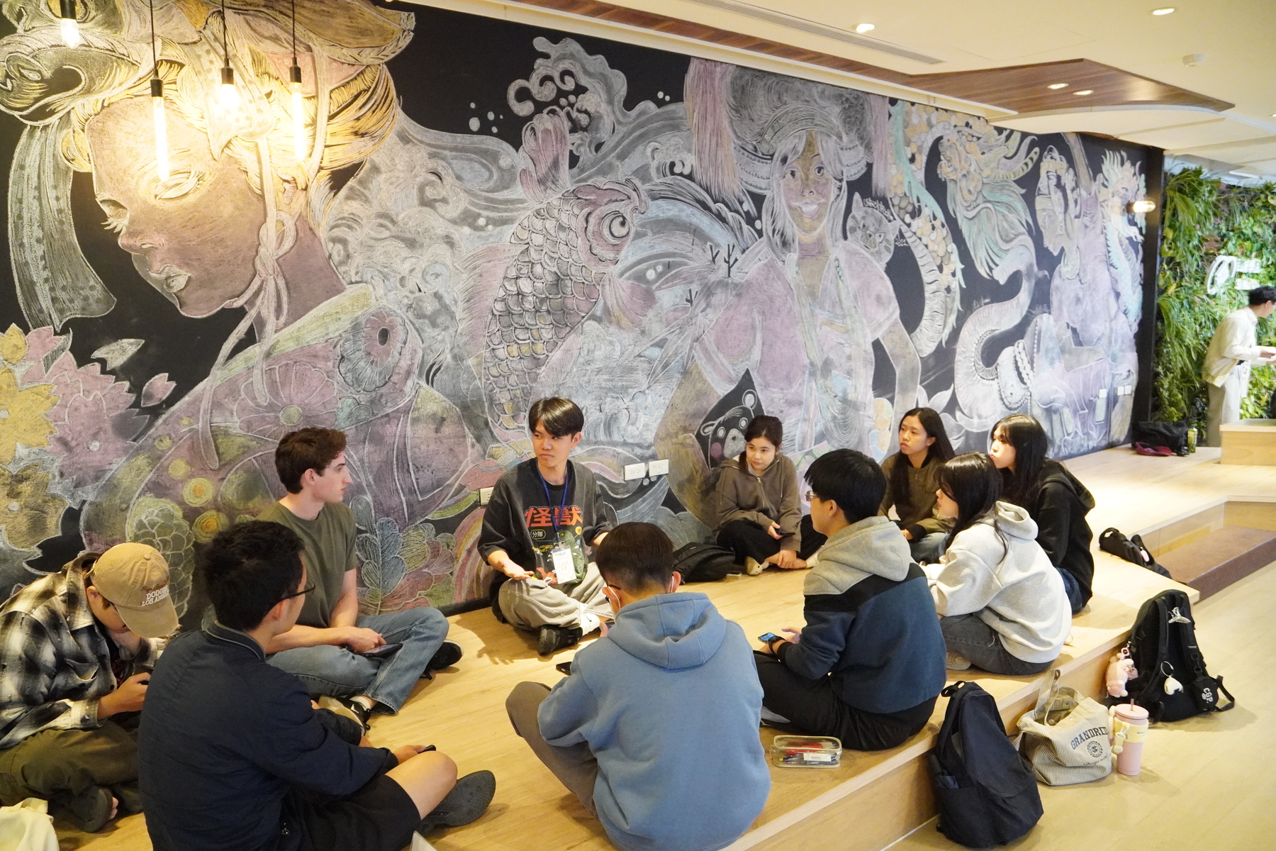 Students engaging in the English Table activity.Image