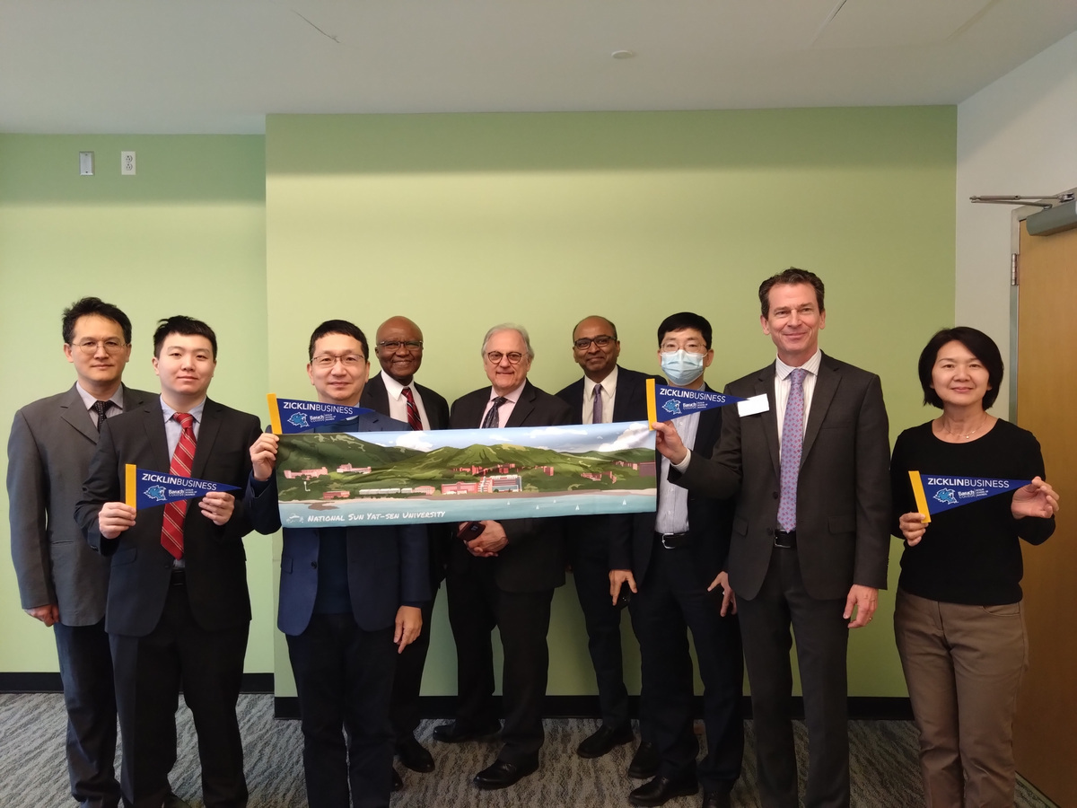 Baruch College's Zicklin School of Business Dean, Bruce Webber, and representatives pose for a photo with Mitch Chou, NSYSU Vice President for International Affairs, and representatives