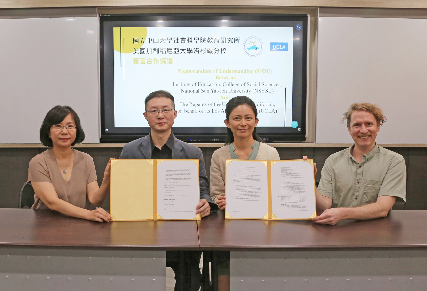 The College of Social Sciences at NSYSU has signed an MOU for transnational academic exchange and cooperation with the School of Education & Information Studies at UCLA. From the left of the photo are Hsueh-Hua Chuang, Program Chair of the International Graduate Program of Education and Human Development at NSYSU, Wen-Bin Chiou, then dean of the College of Social Sciences, Paichi Pat Shein, Chair of the Institute of Education, and Dale Albanese, Assistant Professor of the International Graduate Program of Education and Human Development.
