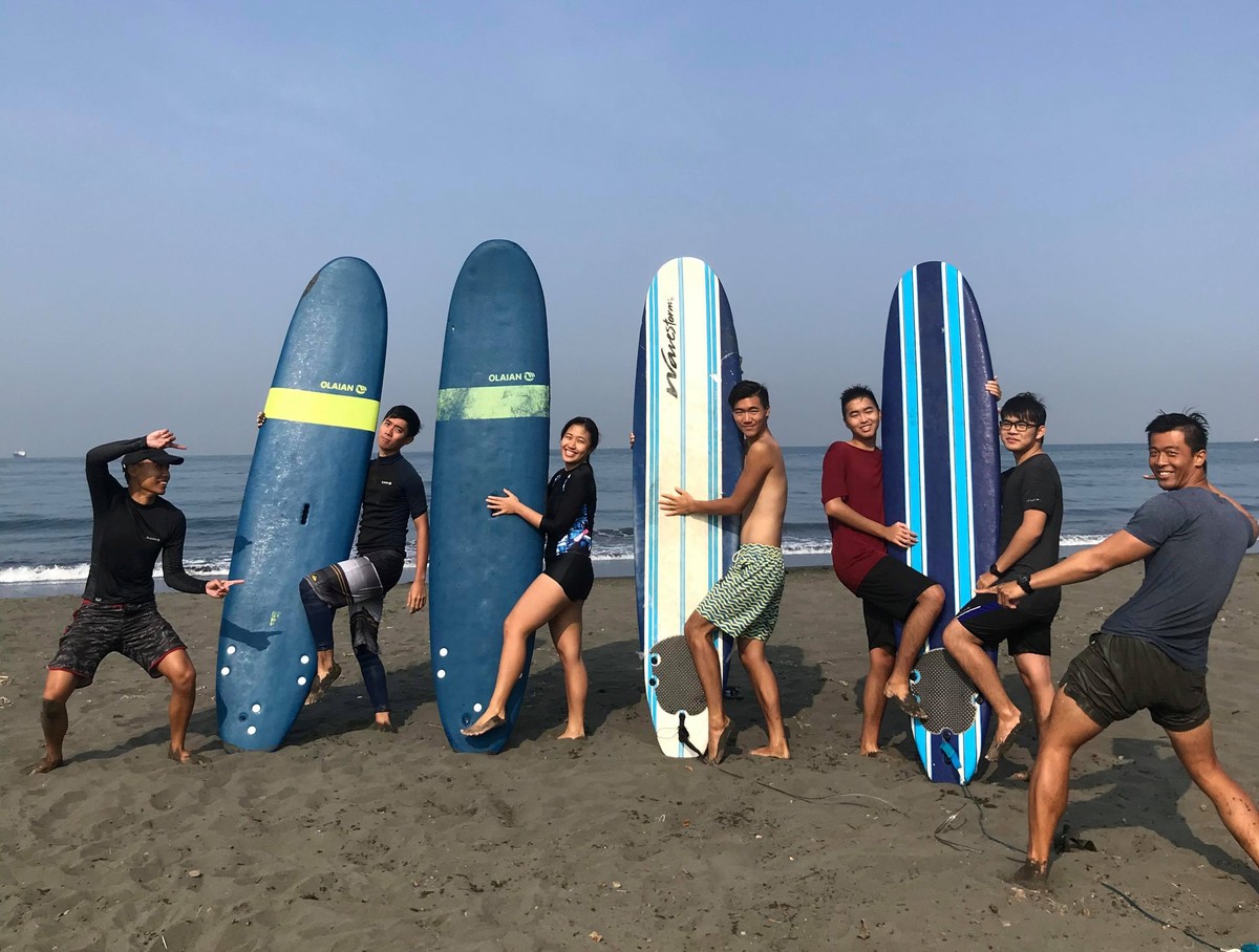 Learn to surf and pay your tuition by collecting trash on the beachImage