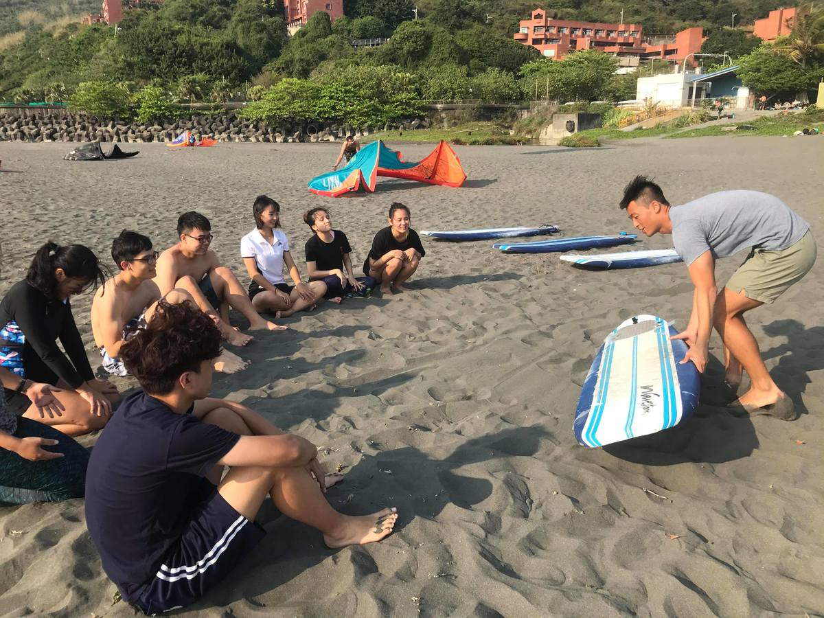 Learn to surf and pay your tuition by collecting trash on the beachImage