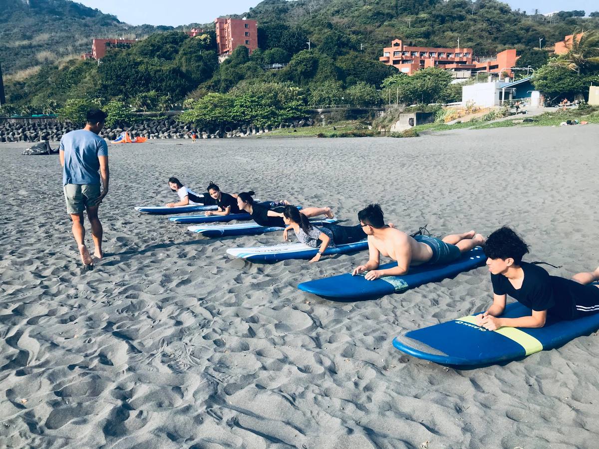 Learn to surf and pay your tuition by collecting trash on the beachImage
