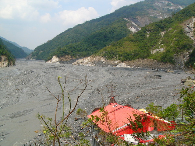 The new settlement of Kucapungane was completely covered by landslide caused by Typhoon Morakot, leaving only the church rooftop untouched.