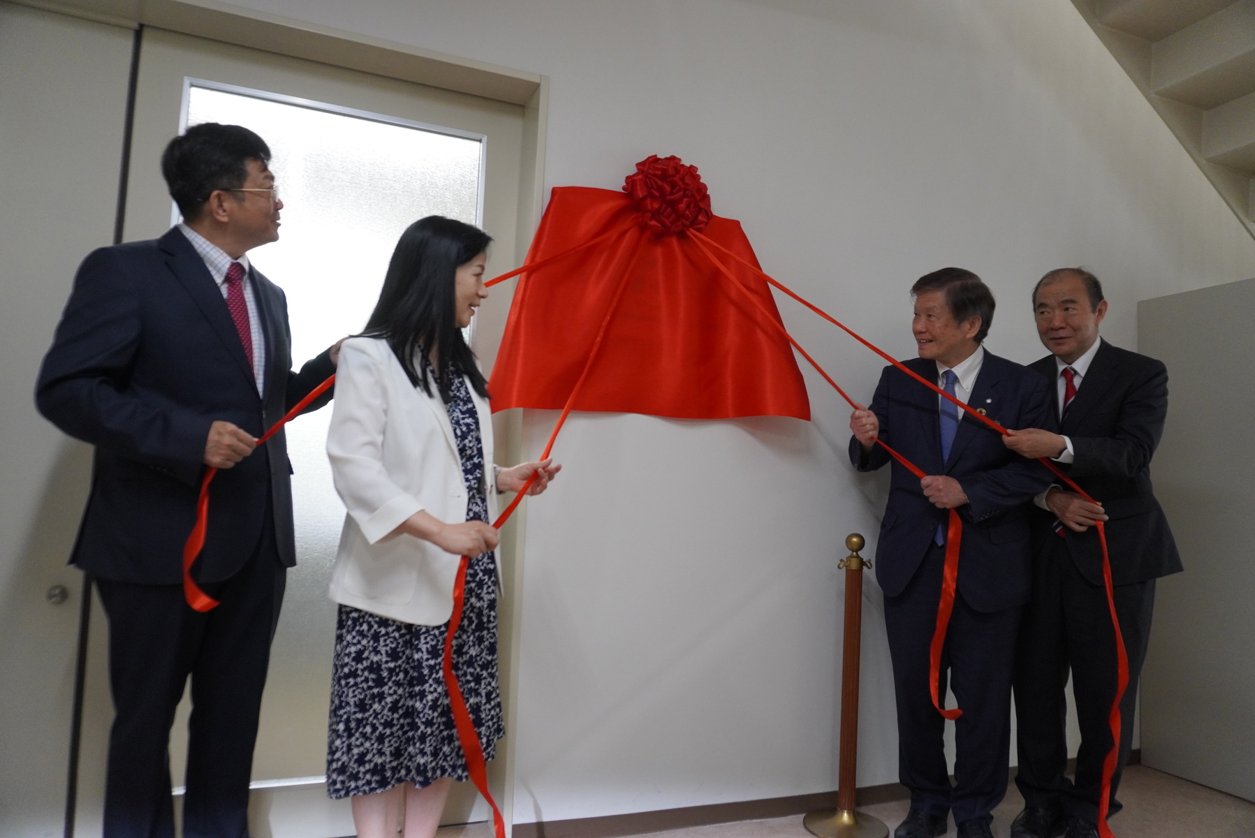 Unveiling the plaque.Image