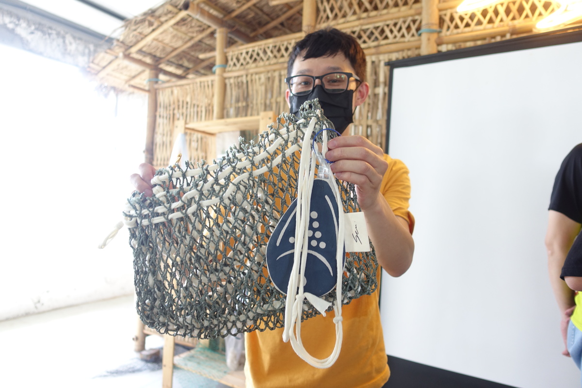 Bag made of discarded fishing net.