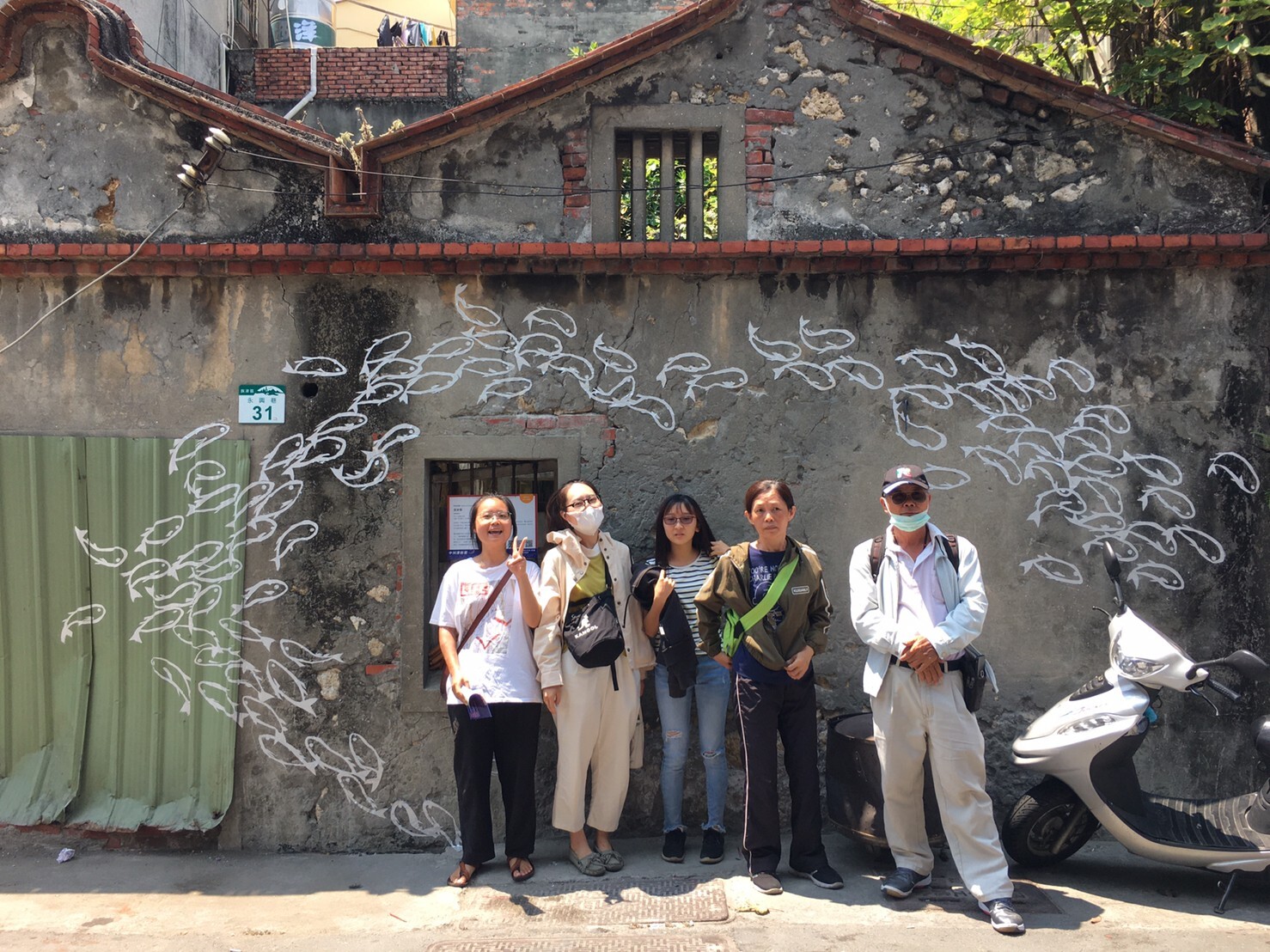 Author of the installation “Migratory School” artist Yun-Shan Lu (first on the left) with her family