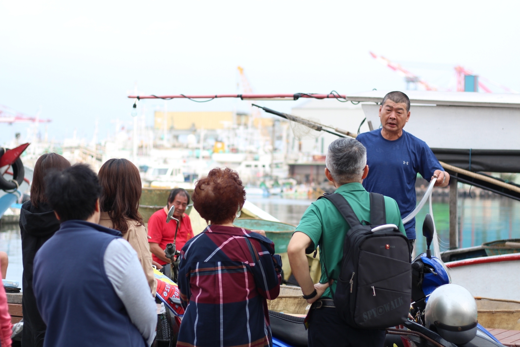 A resident tour guide explains how a fishing line is produced.