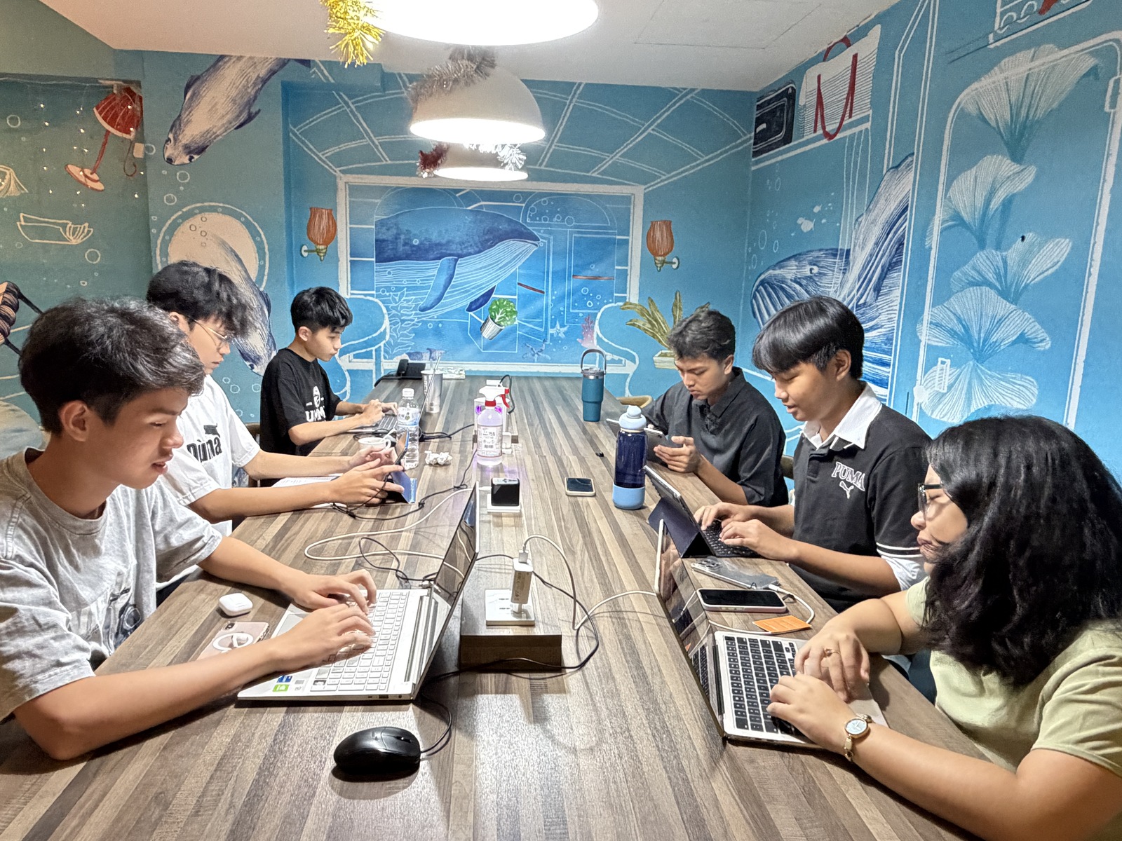 Students Preparing for the Shark Tank Pitch in Their DormitoryImage