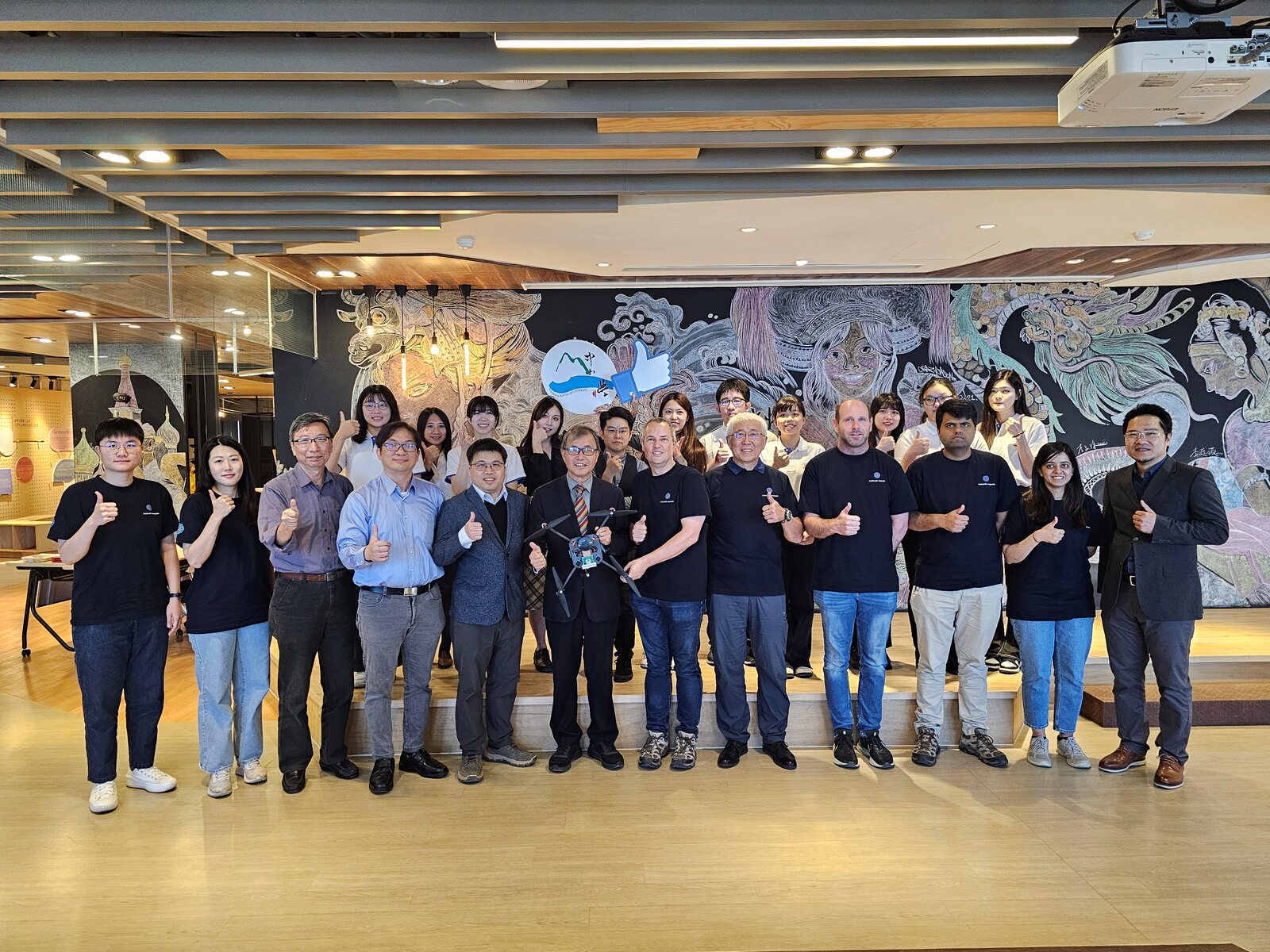 In early 2024, Distinguished Professor Yung-Jr Hung (fifth from left) of the Department of Photonics at NSYSU signed a non-exclusive international technology transfer agreement with Australian drone navigation module developer Azimuth Avionics. (News archive photo)Image
