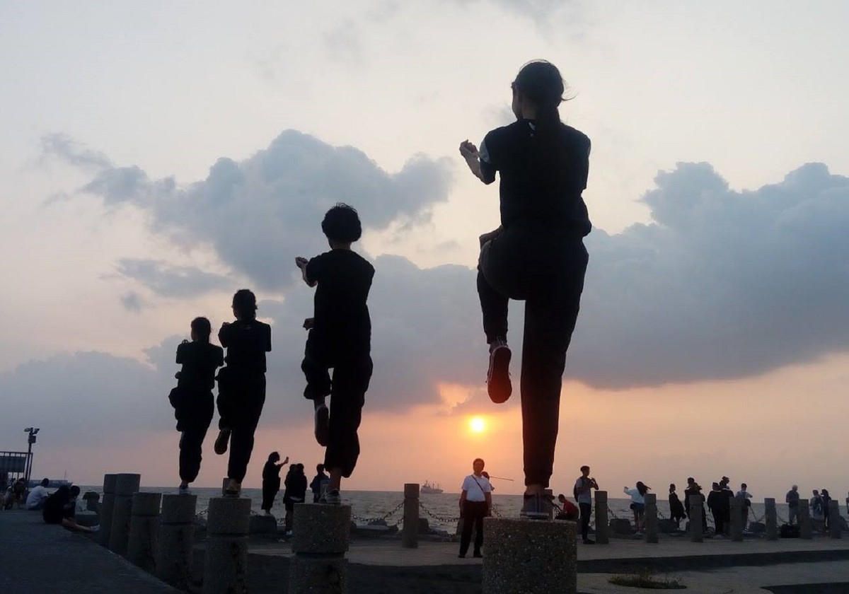Training session at sunset (photo provided by NSYSU Traditional Chinese Martial Arts Club)Image