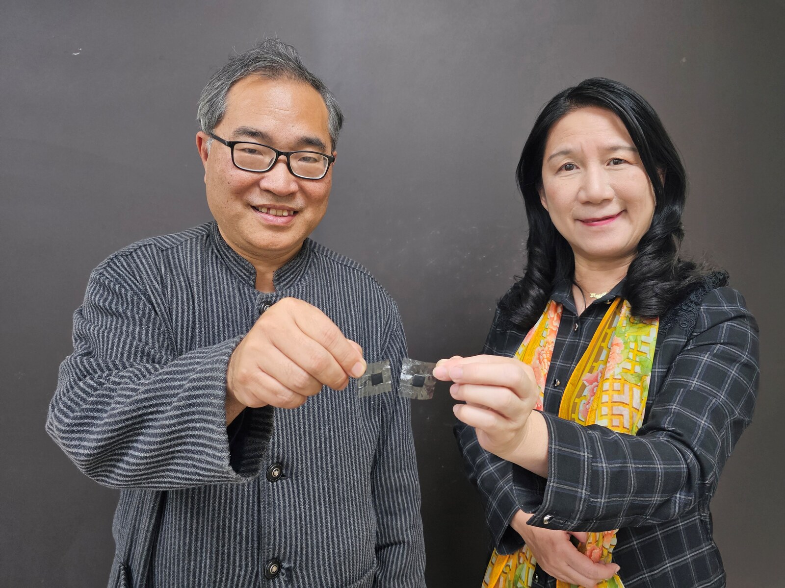 NSYSU professors Wen-Yao Huang (left) and Mei-Ying Chang (right) from the Department of Photonics lead a team that developed novel proton exchange membranes (PEMs), creating a "highway exclusively for protons," that allows them to move faster than ever. Its conductivity is more than twice that of the industry standard DuPont Nafion 211, paving the way for the hydrogen energy industry and net-zero transition.Image