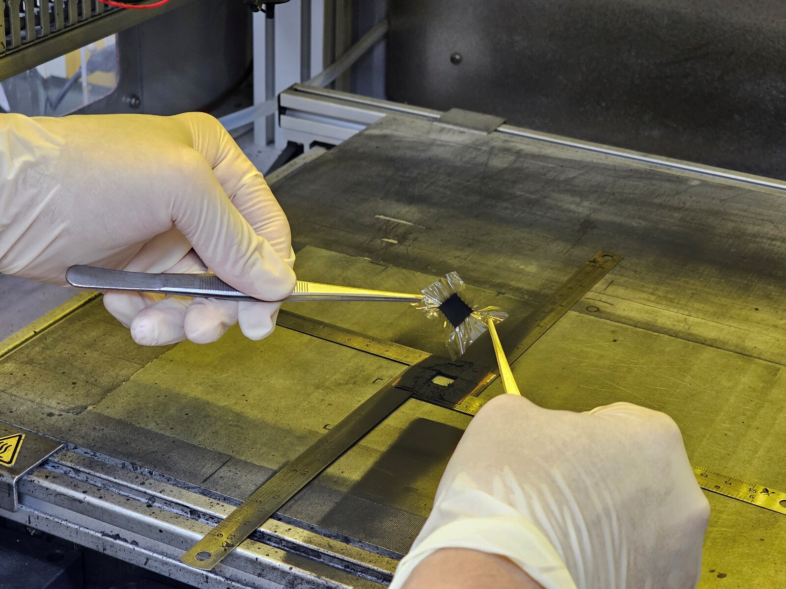 Spray-coating a catalyst onto the proton exchange membrane.Image