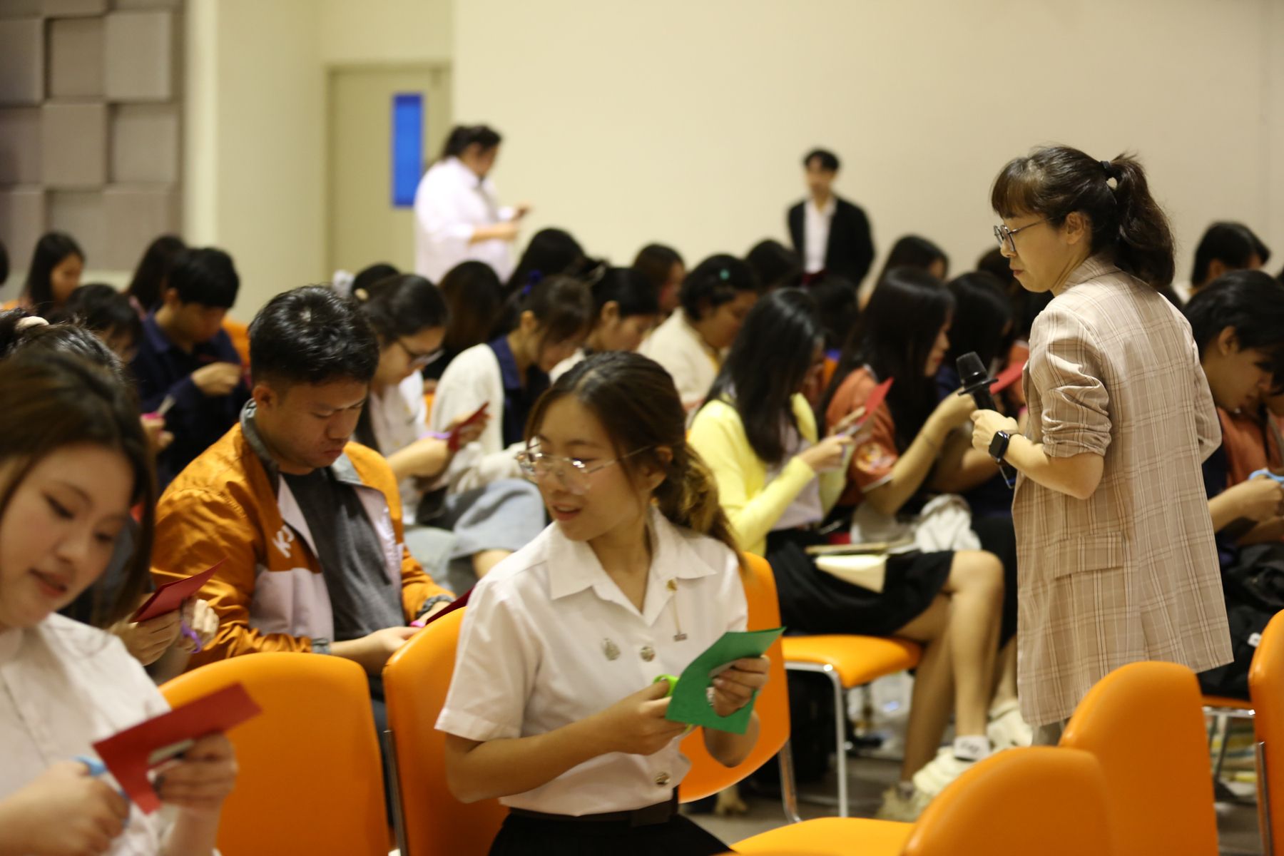 Participants engage enthusiastically in interactive activities.Image