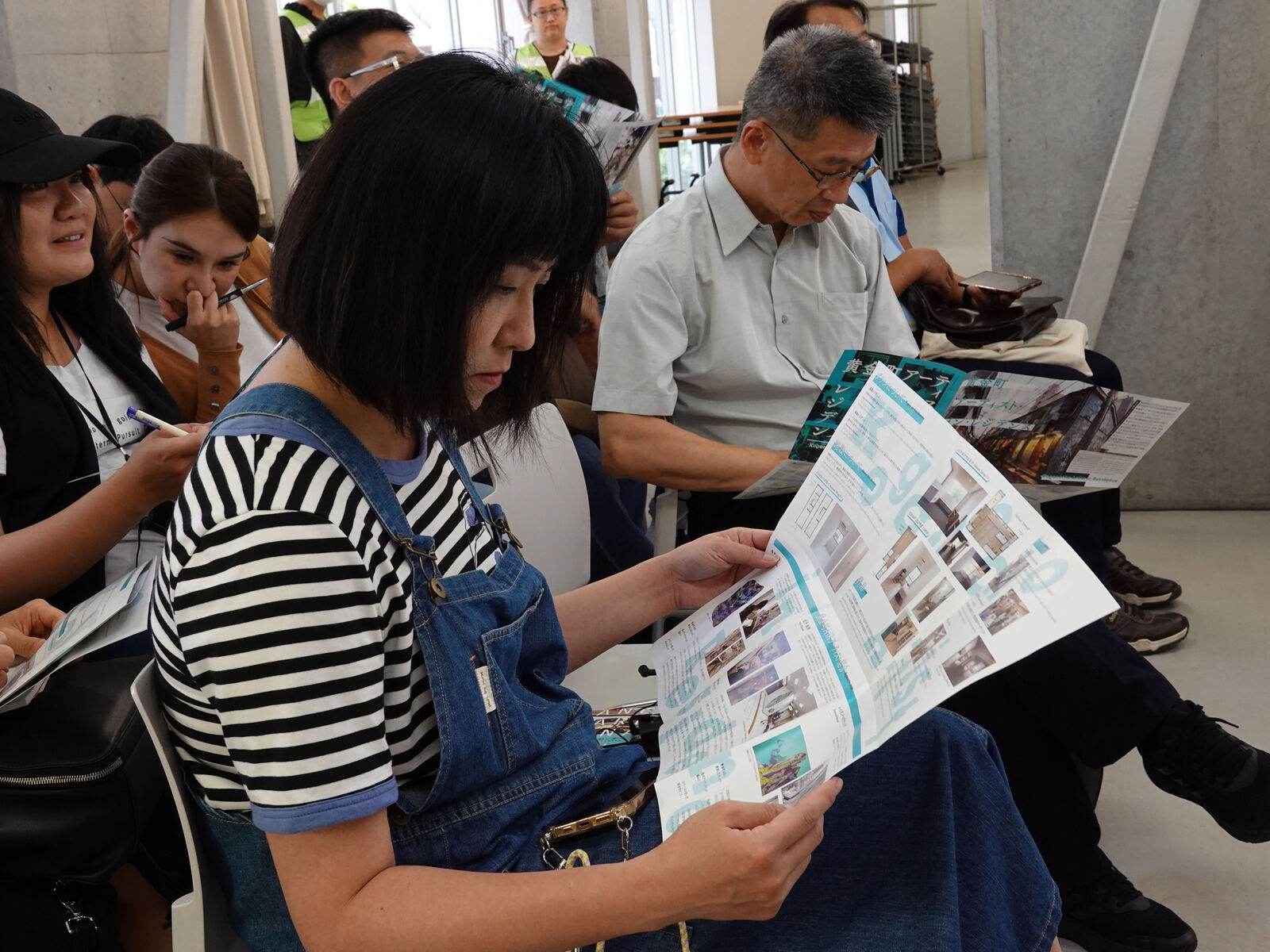 The NSYSU team read the Koganecho Area booklets attentively