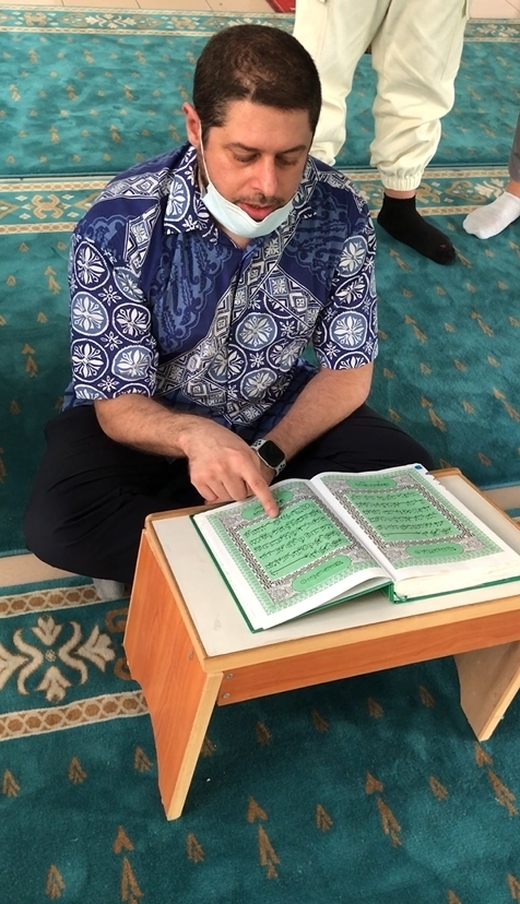 Assistant Professor Slim Ben Said reciting Islamic scriptures.