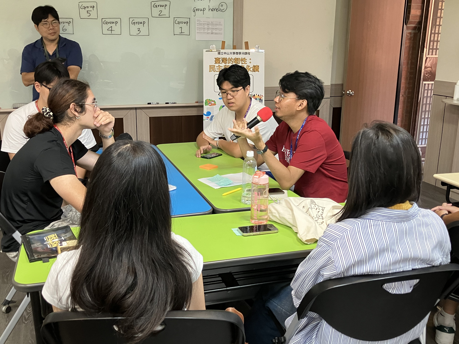 With guidance from instructor Eric Hsu (far left), students opened up and shared their learning experiences in a warm, inclusive setting.Image