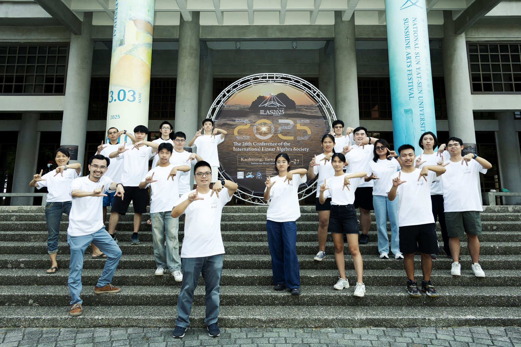The NSYSU organizing team made the "Linear Algebra" gesture.