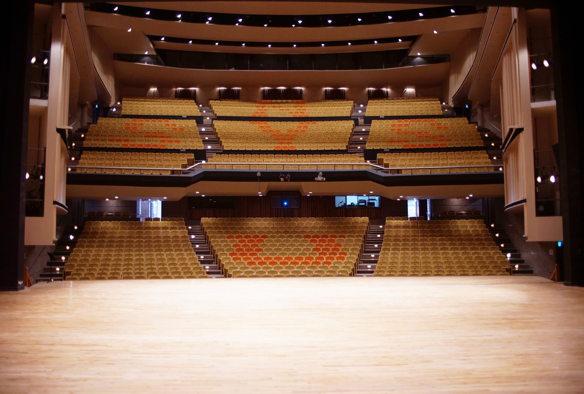 Seats of two different colors feature the NSYSU acronym